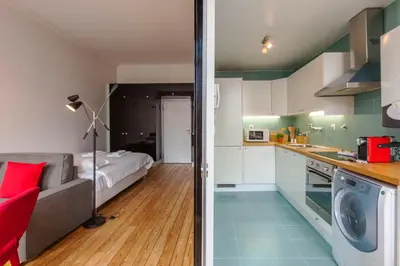 a kitchen and living room with a couch and a bed at Go2oporto - Fontainhas Apartments in Porto
