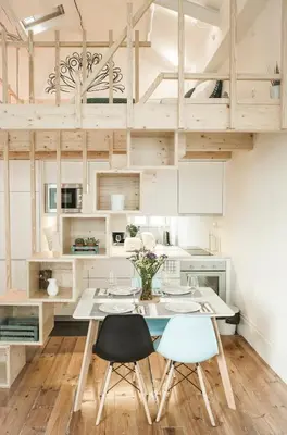 a white kitchen with a table and chairs at Zelije Apartments Trindade in Porto