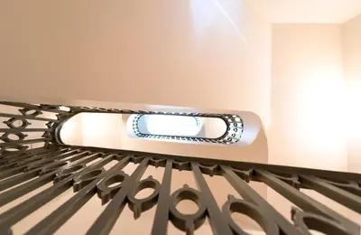 a room with a bed with a mirror on it at LovelyStay - Cativo Mezzanine Studio in Porto