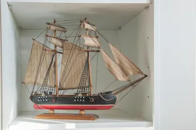 a model of a ship on display in a room at Apartamento À Francos Attic in Porto