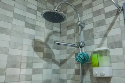 a shower with a shower head in a bathroom at Apartamento À Francos Gyn Lovers in Porto