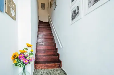 a stairwell with a vase of flowers and a vase of flowers at Apartamento À Francos Gyn Lovers in Porto