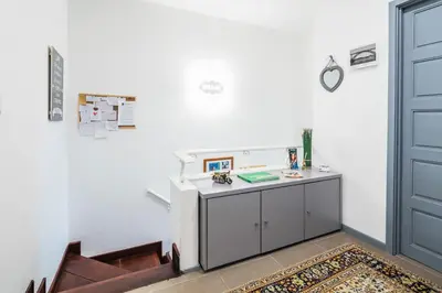 a desk in a room with a door at Apartamento À Francos Gyn Lovers in Porto