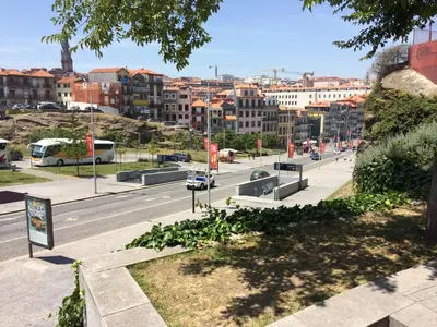 a view of a city street with cars on the road at Downtown PORTO SE in Porto
