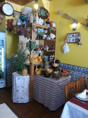 a room with a table with baskets on the wall at Caldeira Guest House in Porto