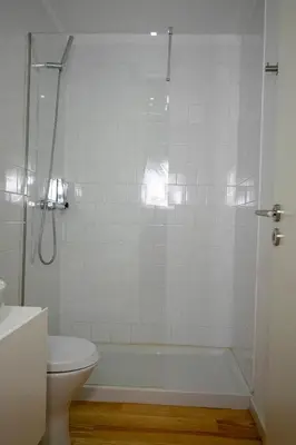 a bathroom with a tub and a toilet and a shower at CL Ildefonso III Apartment in Porto