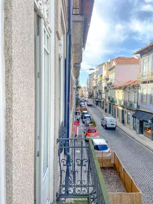 a balcony of a building with a view of a street at CL Ildefonso III Apartment in Porto