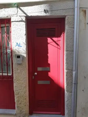 a red door next to a building with a red door at São Bento Golden Flat in Porto