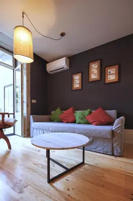 a living room with a couch and a table at Oporto Maison Batalha in Porto