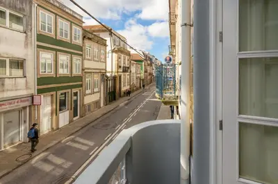 a glass greenhouse around a swimming pool on a building at 731 Costa Cabral Metro Residence in Porto