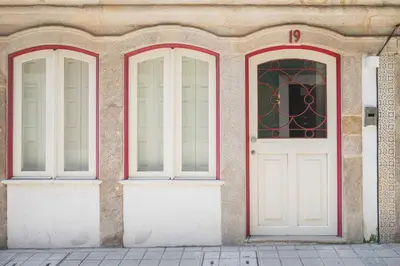 two doors on the side of a building at Modern loft w AC Downtown and Metro in Porto