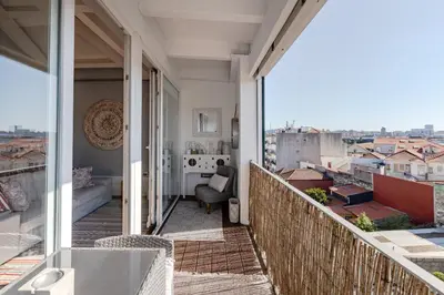 a balcony with a view of a city at Oporto LightHouse Apartment by DA'HOME in Porto