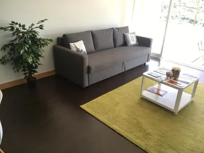 a living room with a couch and a coffee table at Porta do Sol in Porto