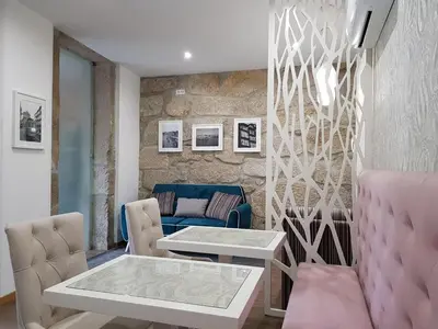 a living room with a table and a couch at 22 Oporto Guesthouse in Porto