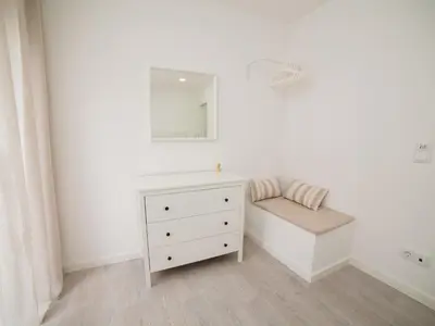 a white bathroom with a dresser and a mirror at OPORTO GUEST Amparo Dollhouse in Porto