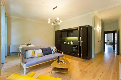 a living room with a couch and a table at Trait House in Porto