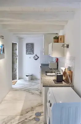 a kitchen with a sink and a counter top at PortoSense Almada in Porto