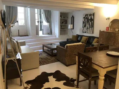a living room with a couch and a table at PortoSense Almada in Porto
