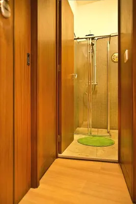 a bathroom with a shower with a glass door at VRS - Porto Centre Trindade Studio in Porto