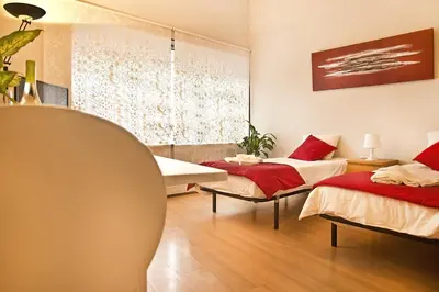 a room with two beds and a window at VRS - Porto Centre Trindade Studio in Porto