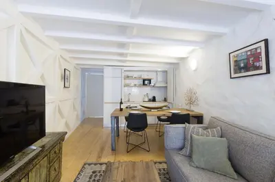 a living room with a couch and a table at VIVA Caldeireiros Porto Old Town in Porto