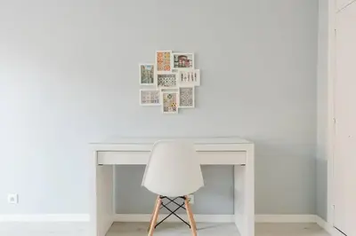 a white desk with a white chair next to it at Lima House in Porto