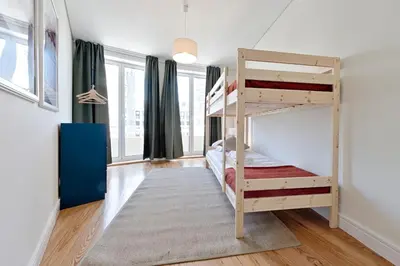 a bedroom with two bunk beds in a room at Sleep in Centre in Porto