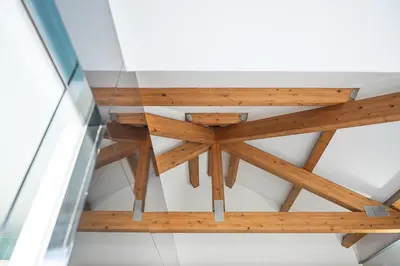 a wooden table in a room with a glass ceiling at GuestReady - Cosy studio in the heart of Porto in Porto