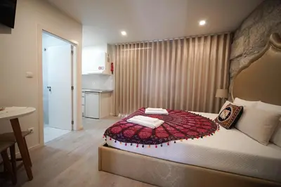 a bedroom with a large bed in a room at The Blue and White Porto House in Porto