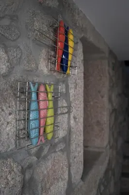 a wall with two colorful vases on a wall at The Blue and White Porto House in Porto