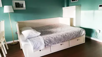 a white bed in a room with a green wall at Porto Downtown Main Str (S.Catarina) + Free Park in Porto