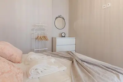 a bedroom with a bed with a dresser and a mirror at Sendme2Portugal: Santa Catarina in Porto