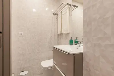 a bathroom with a toilet and a sink and a shower at Sendme2Portugal: Santa Catarina in Porto