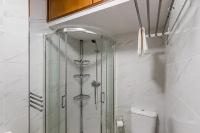 a bathroom with a shower and a toilet in it at GuestReady - Sound of Nature - T1 Boavista in Porto