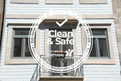 a sign in the window of a building at OportoView Alegria Apartment in Porto
