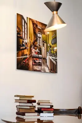 a pile of books on a table in a kitchen at Oporto Chic&Cozy - Ribeira in Porto