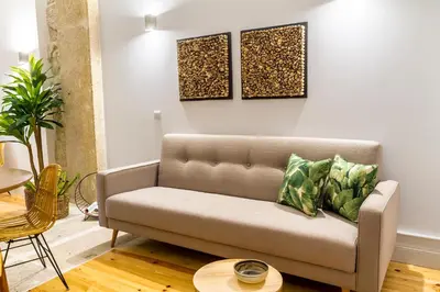 a living room with a couch and a table at Formosa 178 by Guestify in Porto