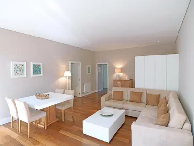 a living room with a couch and a table at FLH Porto Bright Flat in Porto