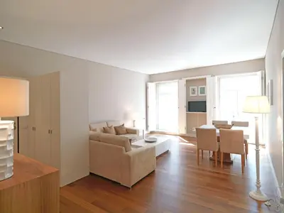 a living room with a couch and a table at FLH Porto Bright Flat in Porto