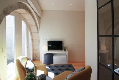 a living room with a tv and a couch at HM - The Garden in Porto