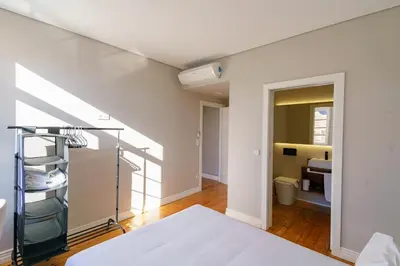 a room with a bed and a bathroom at N Apartments - Bolhão in Porto