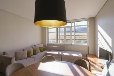 a living room with a couch and a table at N Apartments - Bolhão in Porto