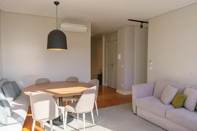 a living room with a table and a couch at N Apartments - Bolhão in Porto