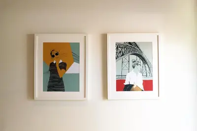 two framed pictures hanging on a wall at HM - Pinheiro Cosy Apartment in Porto