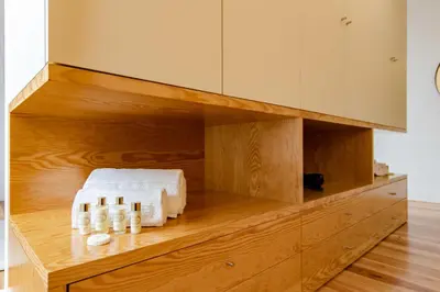 a kitchen with wooden cabinets and white appliances at Amazing Penthouse Apartment in historic Porto in Porto