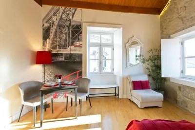 a living room with a table and chairs at Ribeira Stay Apartments in Porto