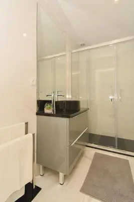a bathroom with a sink and a shower at Downtown Prime Porto in Porto