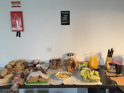 a table with a bunch of food on it at Campanhã Boutique Station in Porto