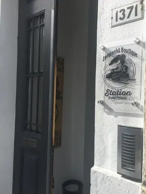 a door to a building with a sign on it at Campanhã Boutique Station in Porto