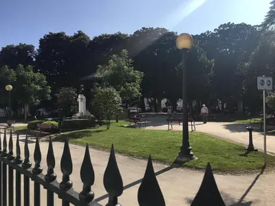 a fence with a street light in a park at AmaOporto - St. Ildefonso in Porto